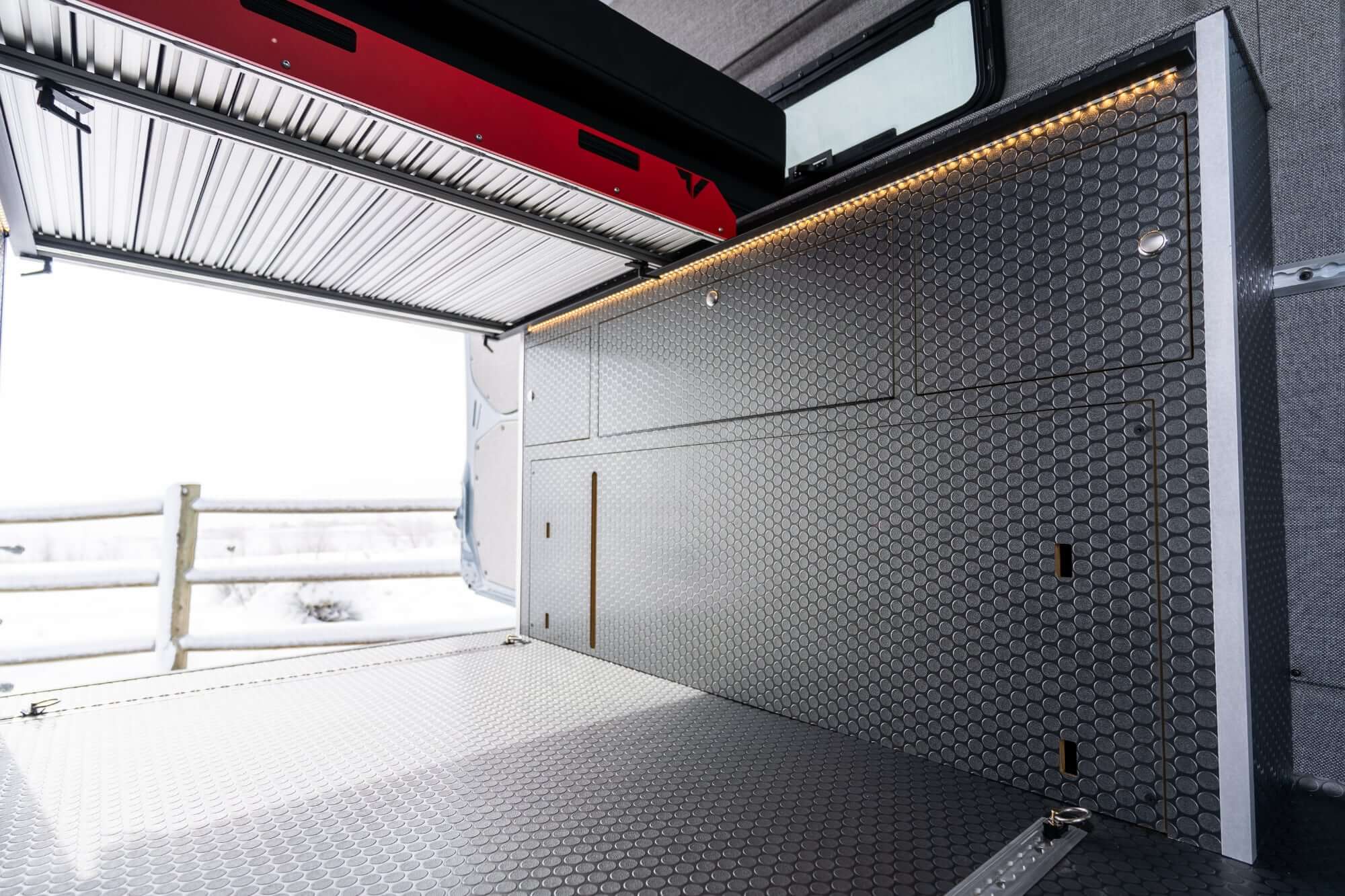 camper van interior with bed kitchen and sofa bed