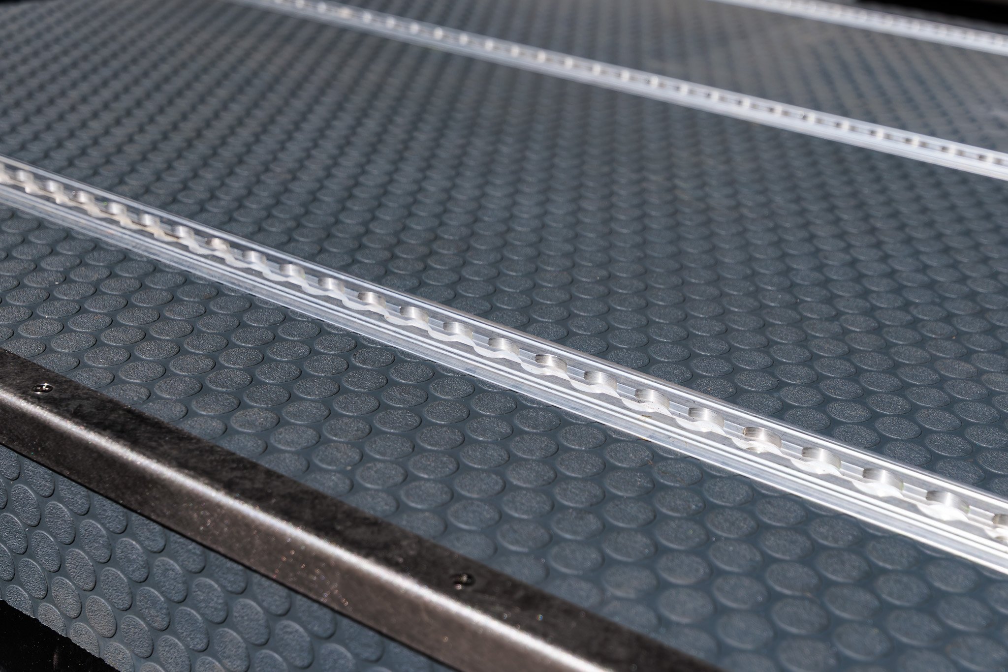 Recessed floor L-track running through the marine grade flooring