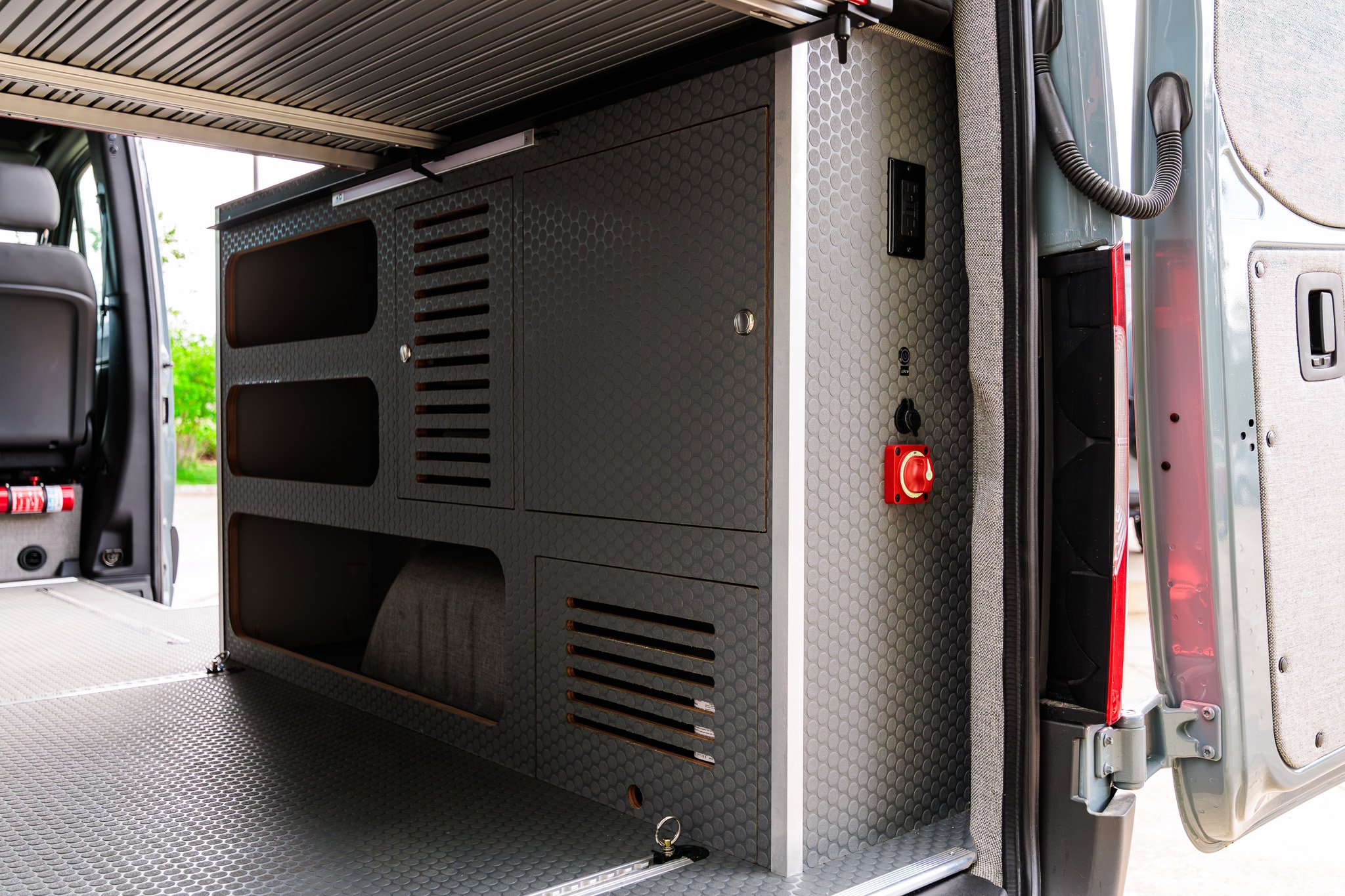 Rear garage cabinetry with the vented gear lockers