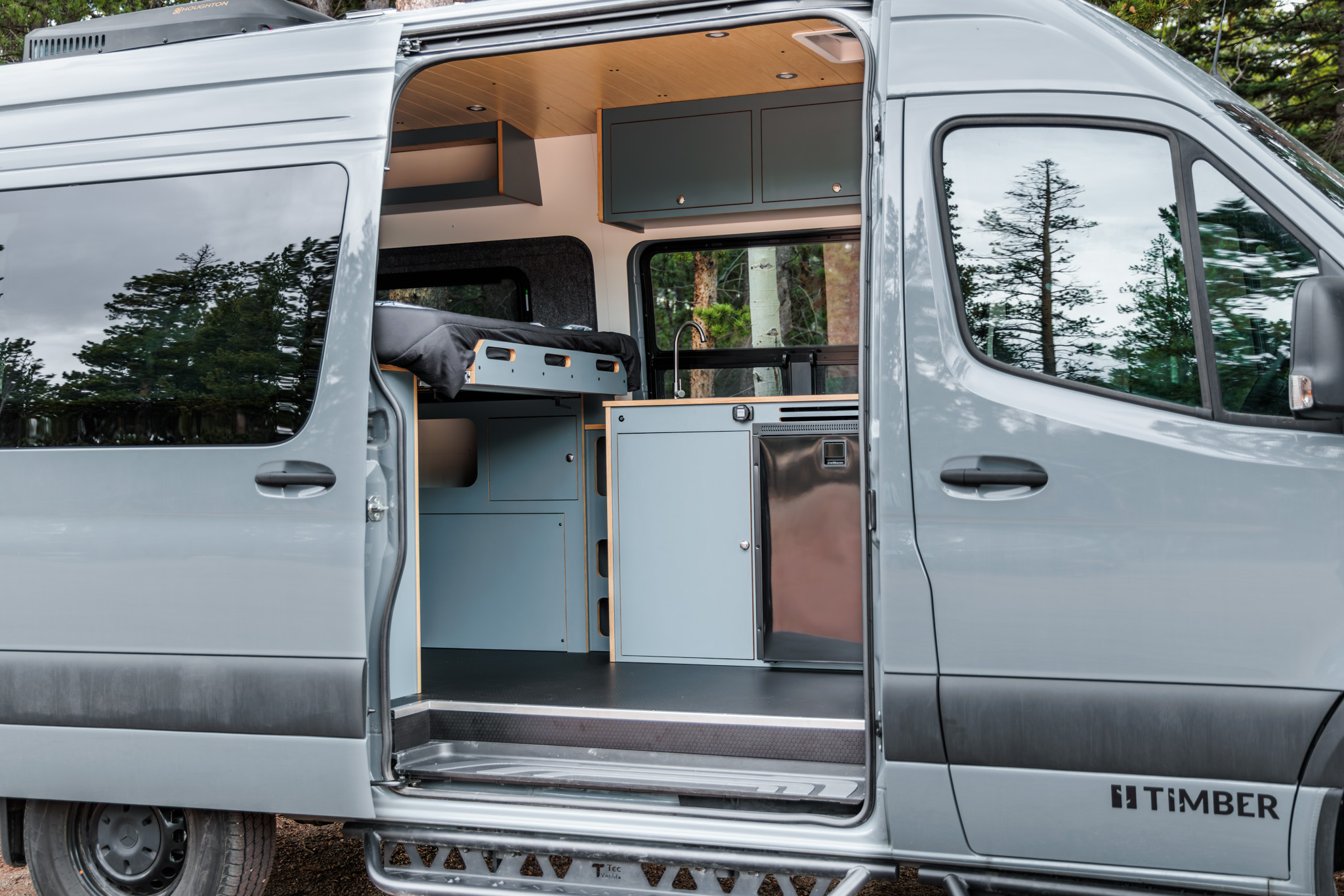 Sliding door open on the galley, fridge and cabinetry