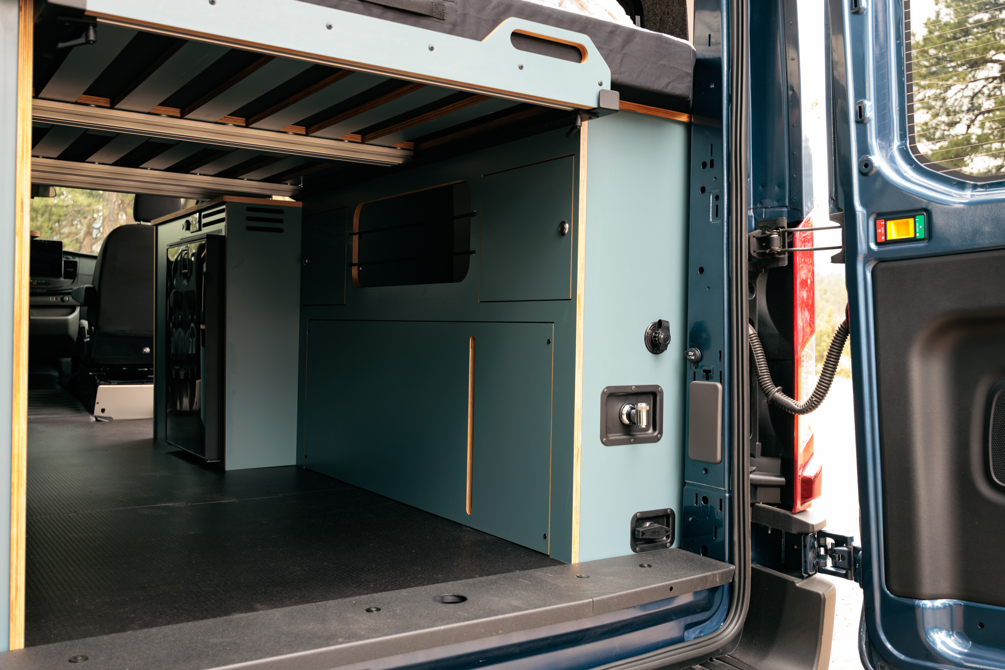 Rear doors open on the storage area under the bed