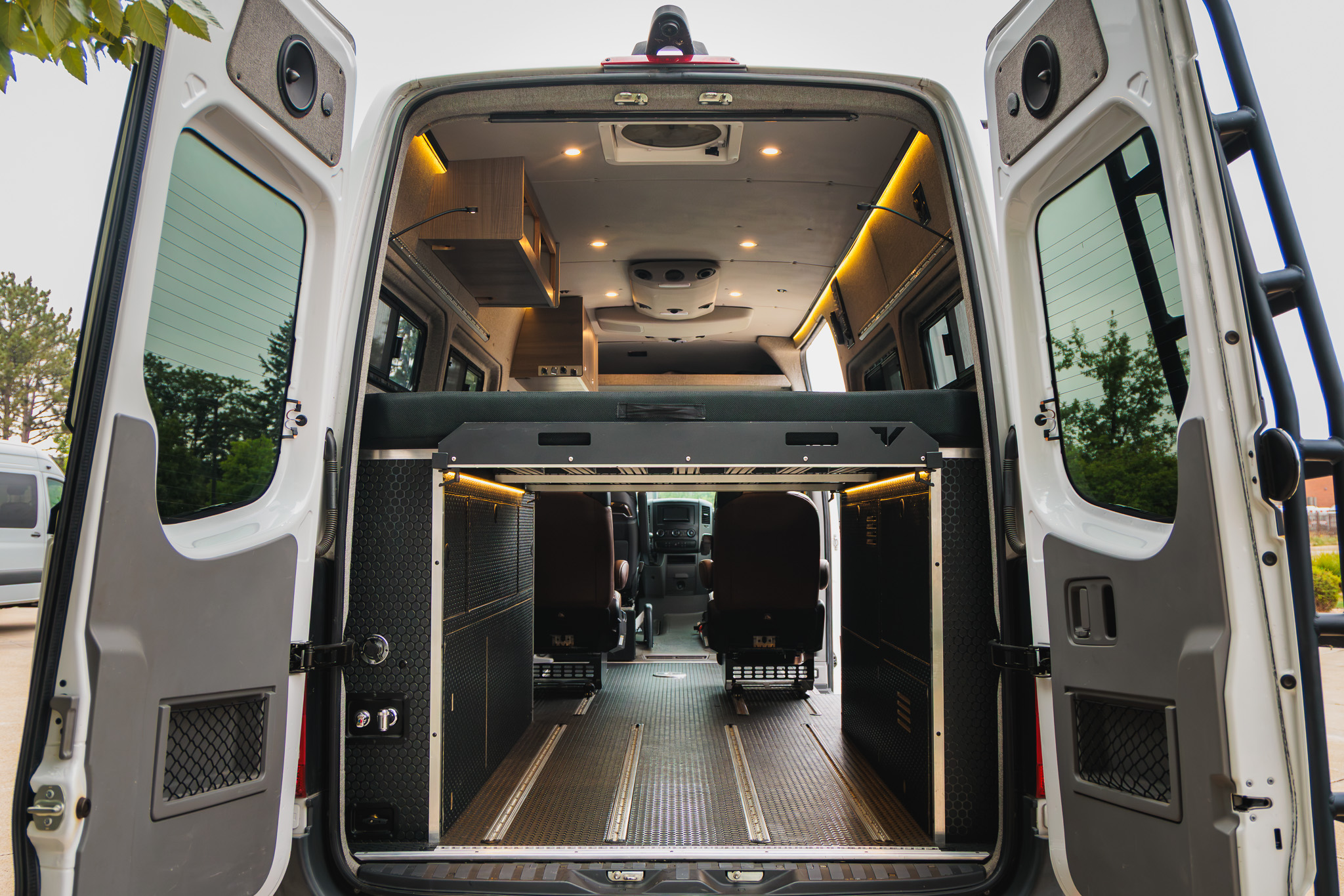 Rear doors open, cargo area view toward the cab