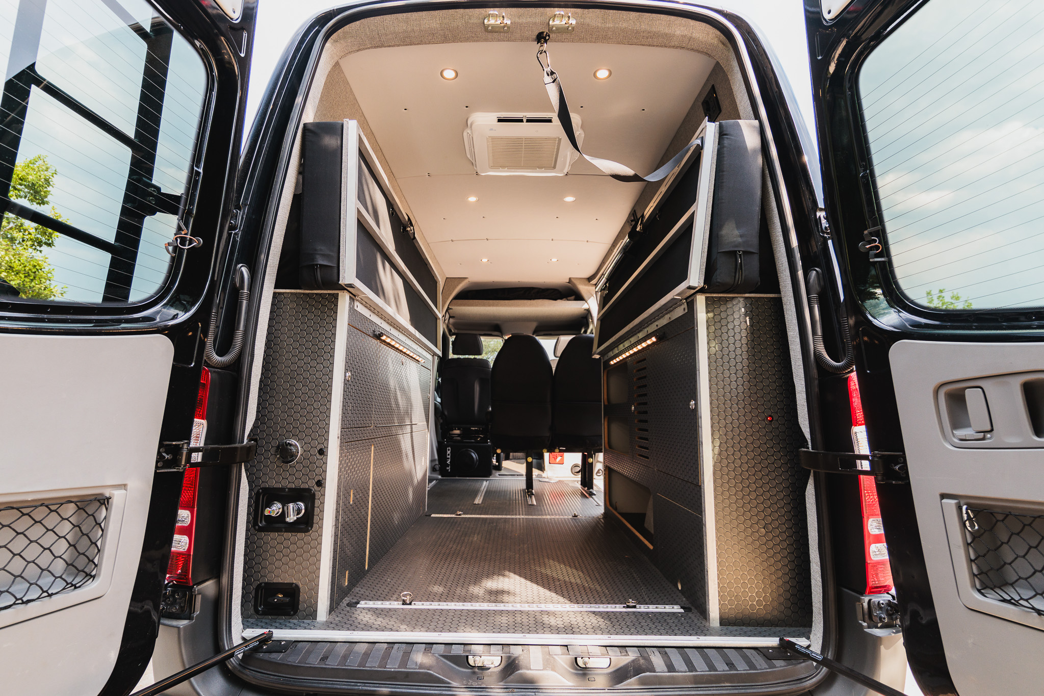 Rear doors open, view through the cargo area to the cab