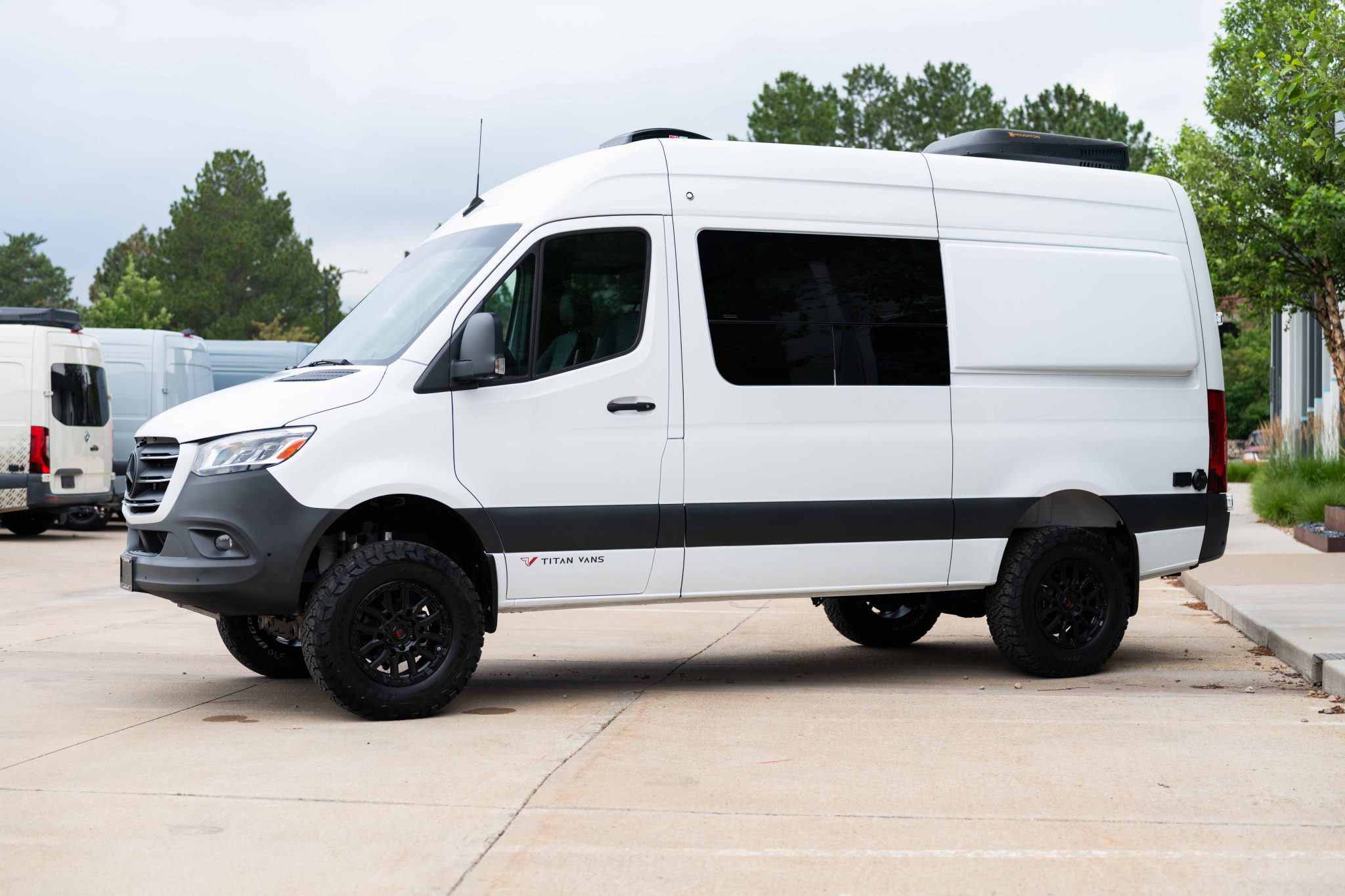 Driver side profile of the Arctic White Sprinter 144 High Roof