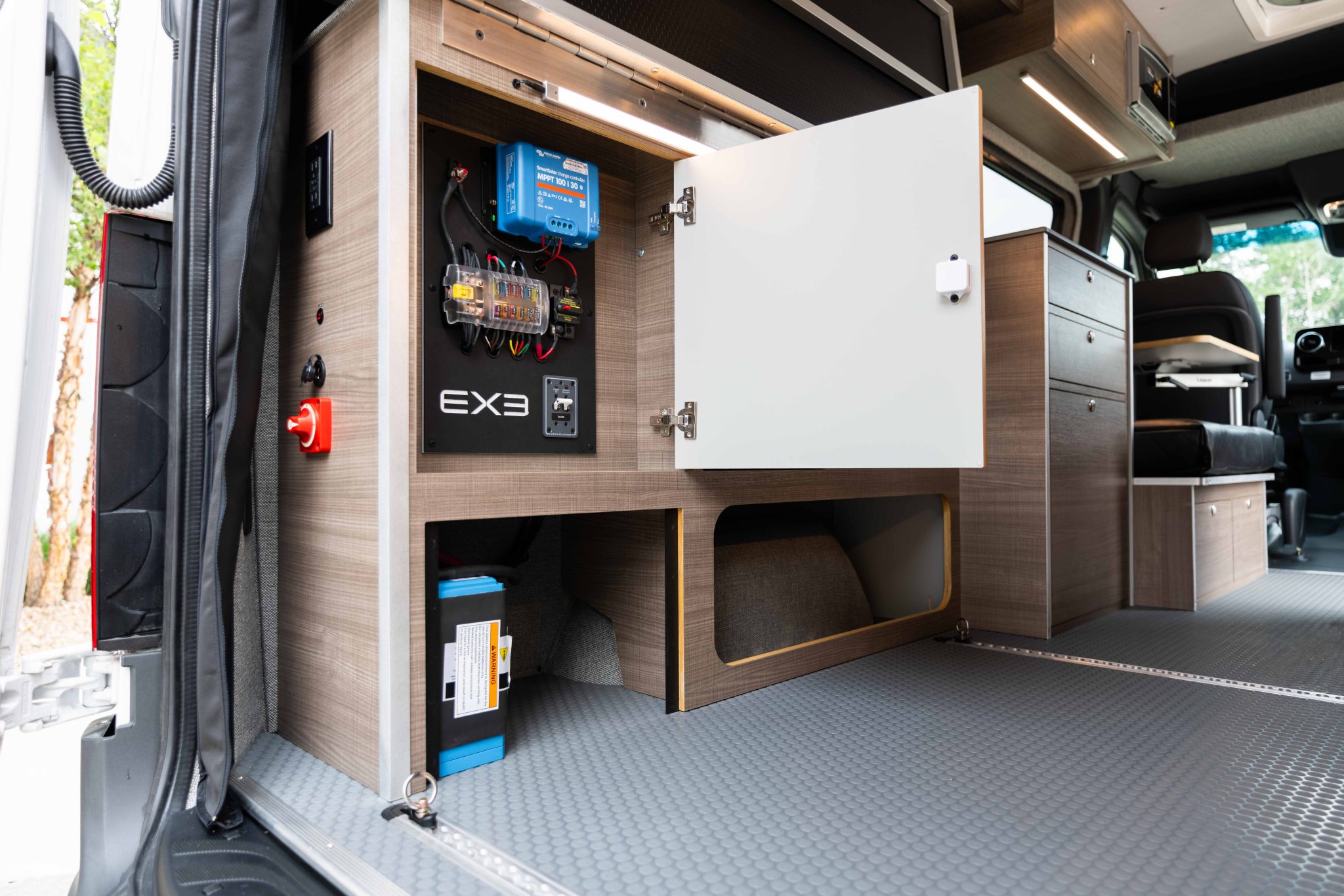 Electrical compartment open, with the control panel and the battery below
