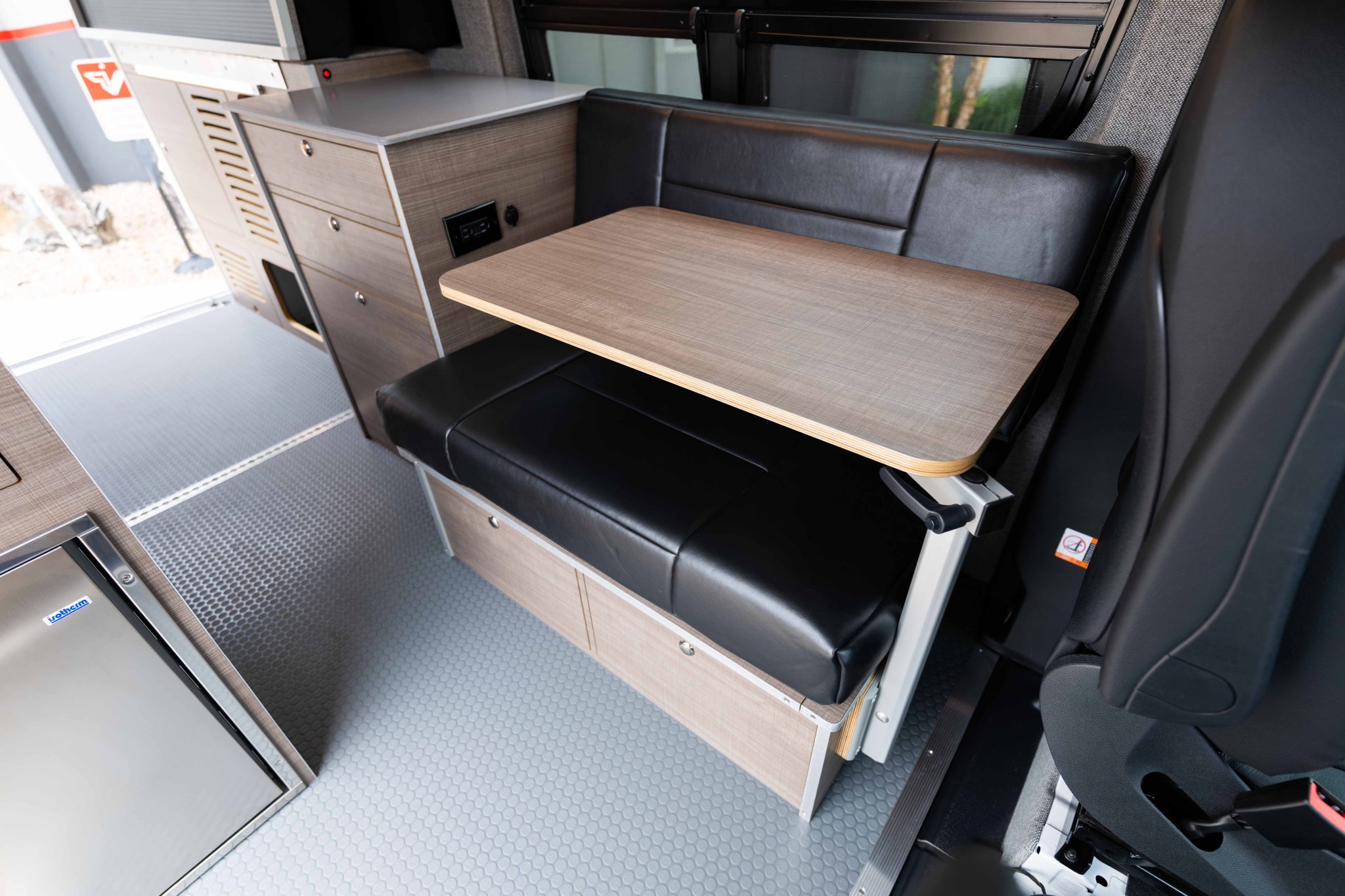 Dinette bench in Charcoal upholstery with the table deployed