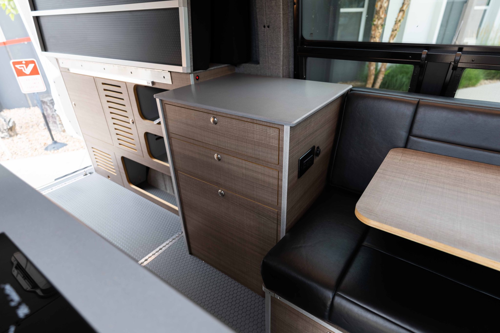 Drawer unit in Elm laminate beside the dinette bench