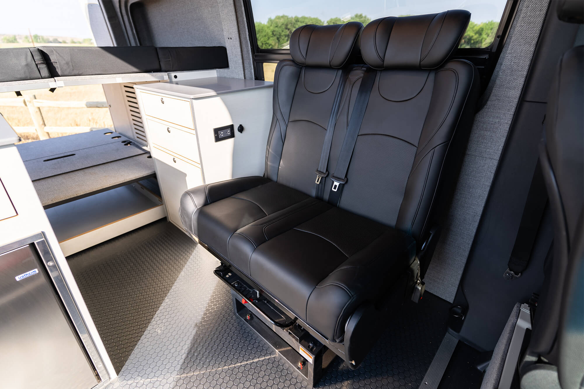 camper van sofa bed swiveled to face the slider door