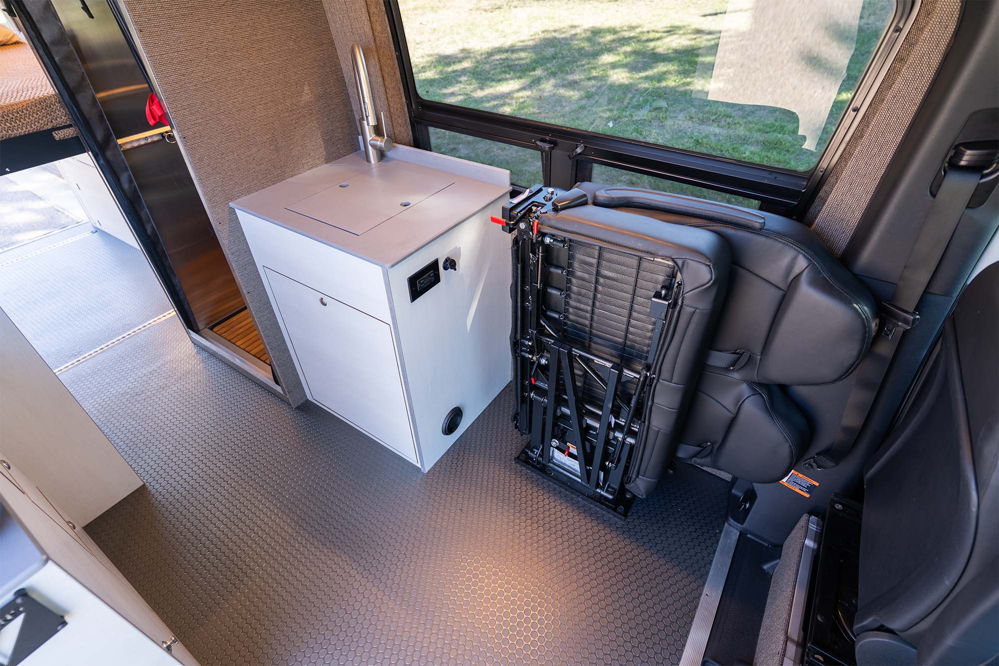 Camper van galley and fold-away bench seat