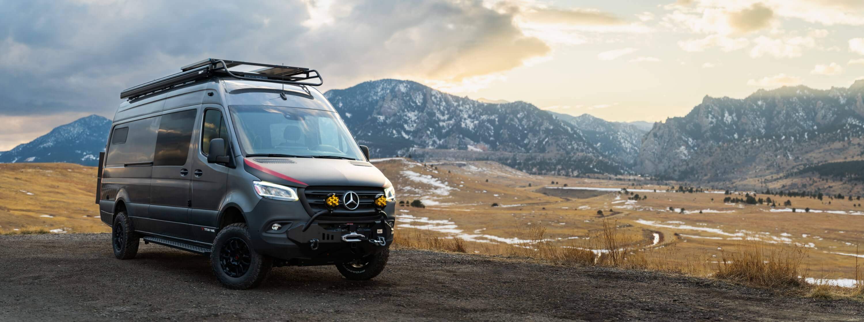 A Titan Vans camper van parked below the Flatirons in Boulder, Colorado