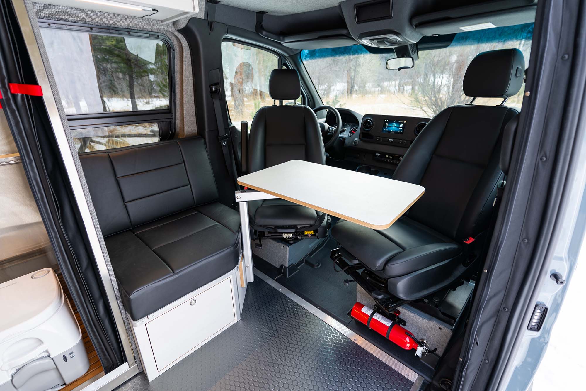 The rear couch with the swivel seats facing the adjustable Lagun table