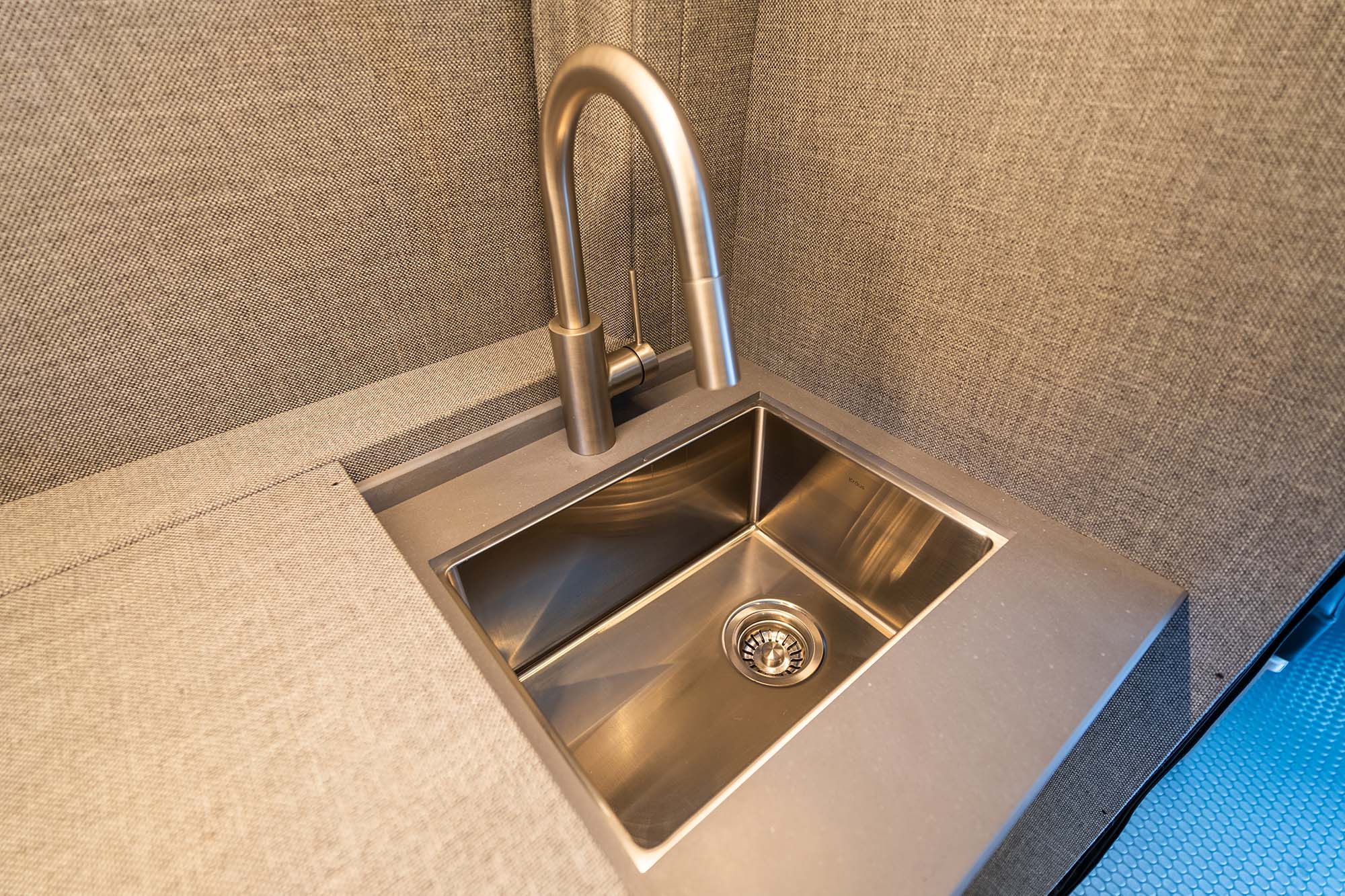 The stainless steel sink found in the Ultra camper van models