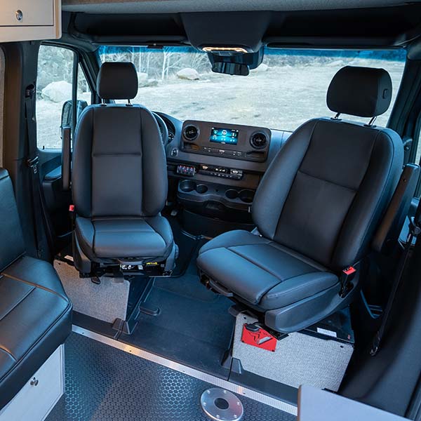 Swivel base under a van front seat