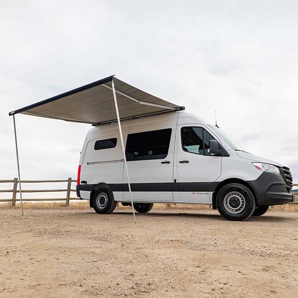 deployed awning attached to campervan