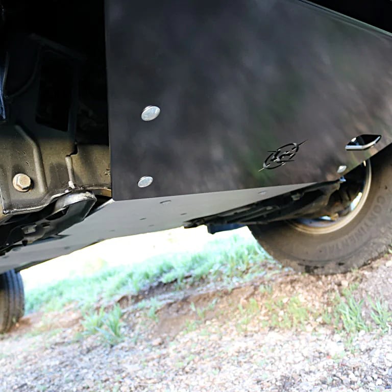 Skid plates on the bottom of a van
