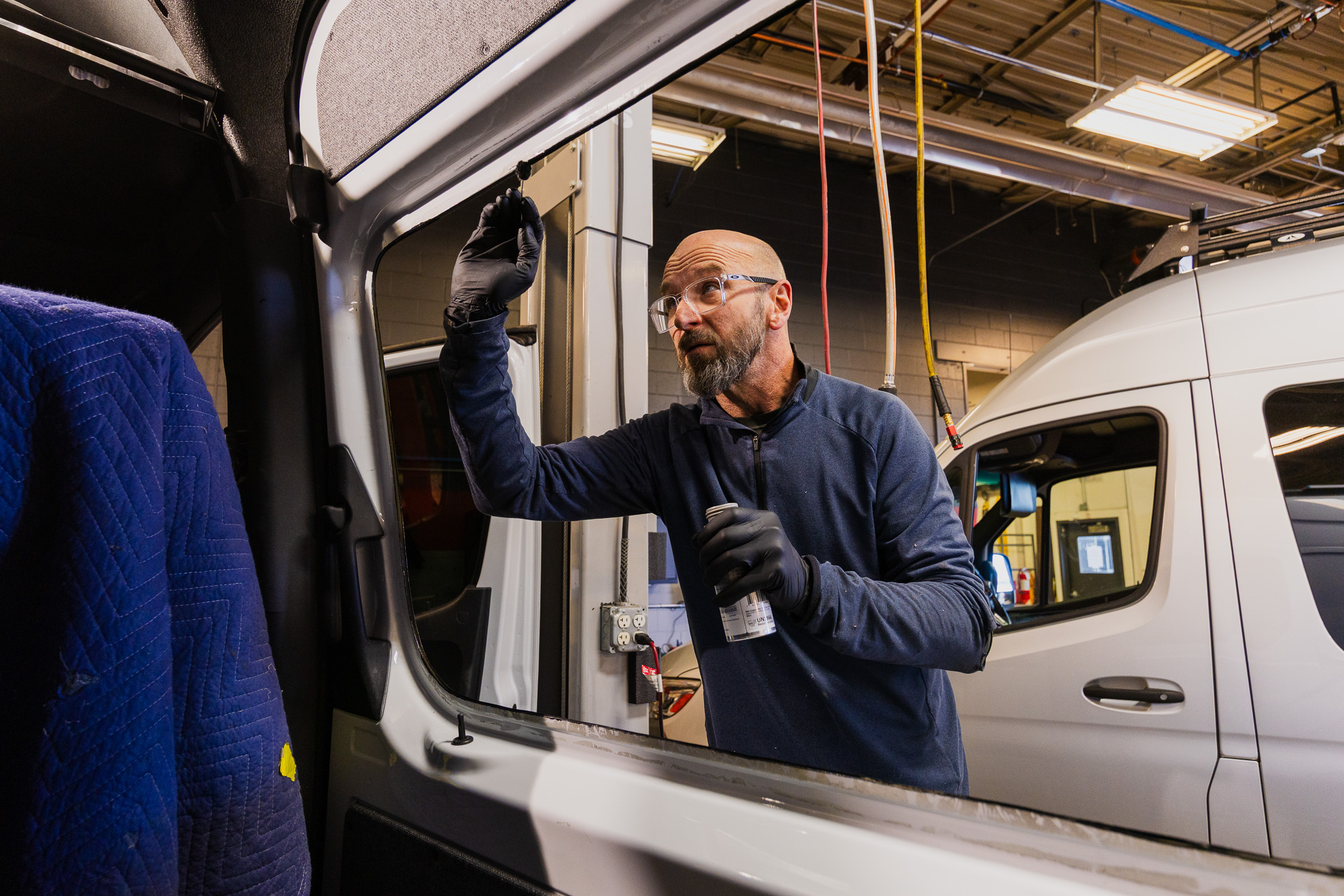 Titan Vans Technician Preparing a Cutout for a Window Install